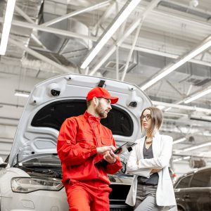 woman-client-with-auto-mechanic-at-the-car-service.jpg